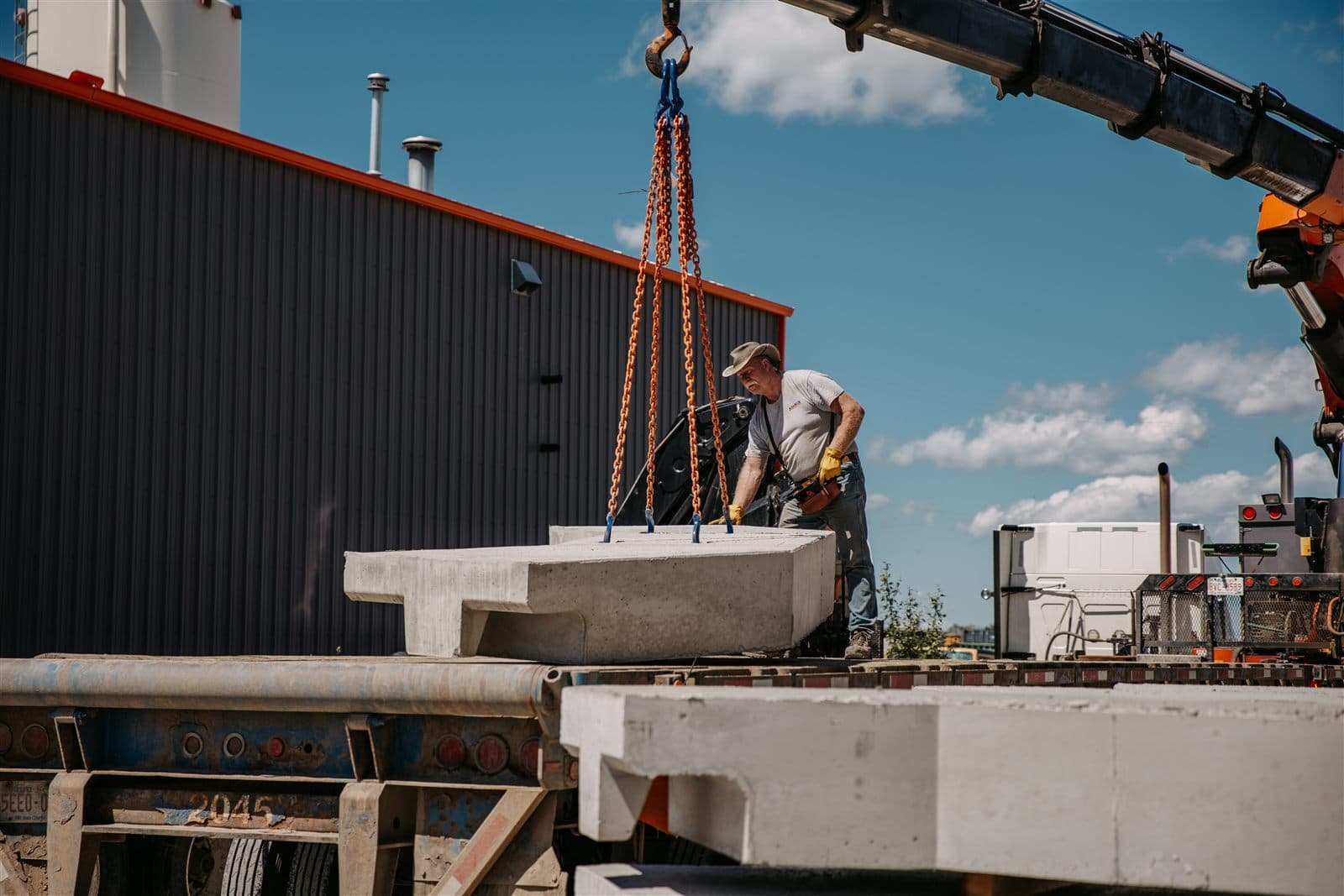 An AltaMix worker rigging a custom precast piece for the crane truck.